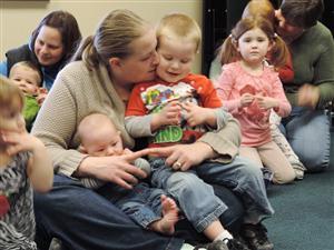 Parent with children in lap